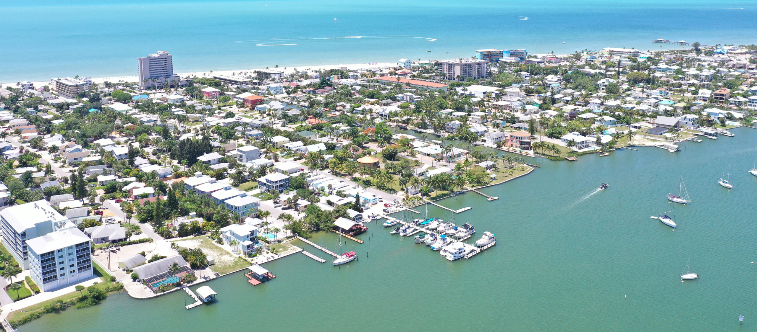 Aerial view of Fort Myers Beach with clear skies and coastal landscape.