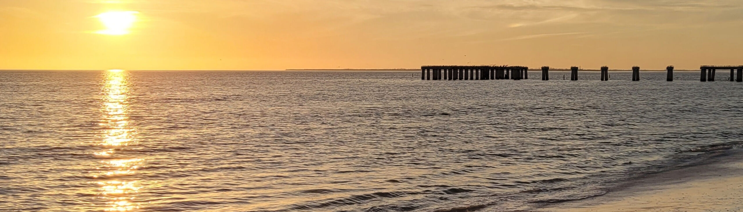 beach sunset and pier